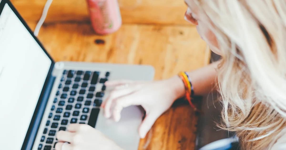 Creator writing an email campaign on a laptop